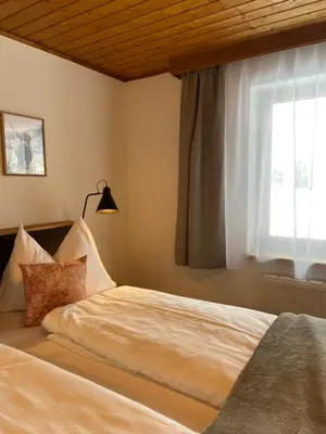 Ein Bett oder Betten in einem Zimmer der Unterkunft Zirbis Bergzauber