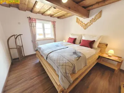 Ein Bett oder Betten in einem Zimmer der Unterkunft Apartment Klampfner by FiS - Fun in Styria
