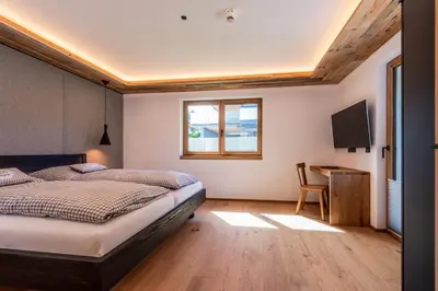 Ein Bett oder Betten in einem Zimmer der Unterkunft Chalets Almadel by Schladmingurlaub