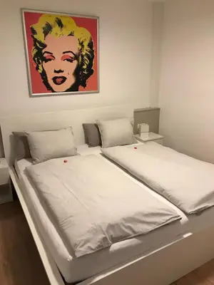 Ein Bett oder Betten in einem Zimmer der Unterkunft Kleine feine Wohnung Gmunden City