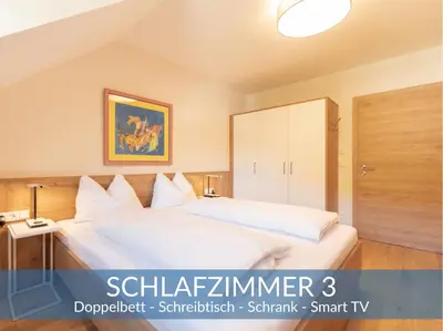 Ein Bett oder Betten in einem Zimmer der Unterkunft Ferienhaus Nikolaus by Heimathaus Dengg - Ski & Wanderurlaub nahe Obertauern im Salzburger Land