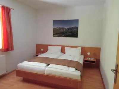 Ein Bett oder Betten in einem Zimmer der Unterkunft Sportlerhof
