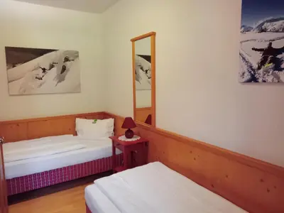 Ein Bett oder Betten in einem Zimmer der Unterkunft Sportlerhof