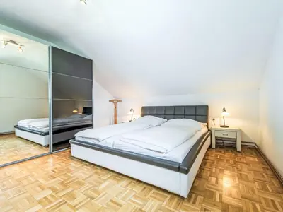 Ein Bett oder Betten in einem Zimmer der Unterkunft Apartment Ferienwohnung Grimmingblick by Interhome