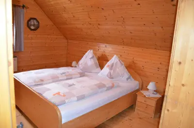 Ein Bett oder Betten in einem Zimmer der Unterkunft Ferienhaus Anna