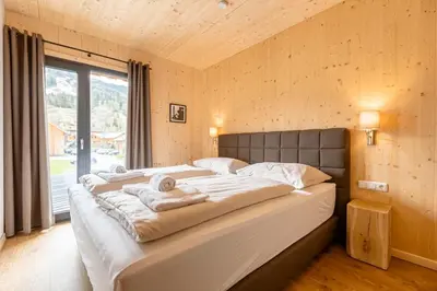 Ein Bett oder Betten in einem Zimmer der Unterkunft Apartments Kreischberg Chalets by ALPS RESORTS
