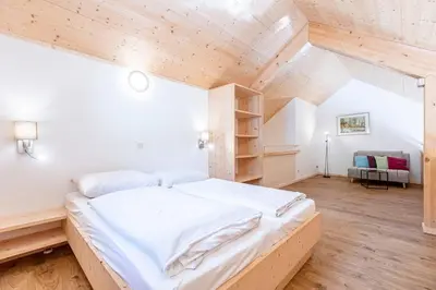 Ein Bett oder Betten in einem Zimmer der Unterkunft Apartments Kreischberg Chalets by ALPS RESORTS