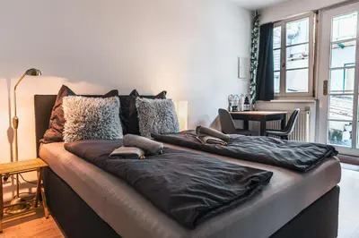 Ein Bett oder Betten in einem Zimmer der Unterkunft Im Herzen von Bad Ischl #1