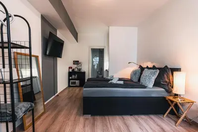 Ein Bett oder Betten in einem Zimmer der Unterkunft Im Herzen von Bad Ischl #1