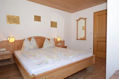 Ein Bett oder Betten in einem Zimmer der Unterkunft Weinbachbauer - Urlaub am Bauernhof