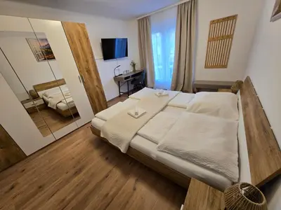 Ein Bett oder Betten in einem Zimmer der Unterkunft Haus Bellaflora Apartman