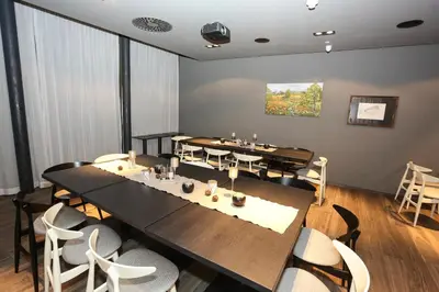 Ein Restaurant oder anderes Speiselokal in der Unterkunft Badhaus - Hotel/Restaurant/Café