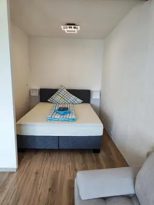 Ein Bett oder Betten in einem Zimmer der Unterkunft Ferienwohnung - Apartment Pichlarn Holiday Grimmingblick