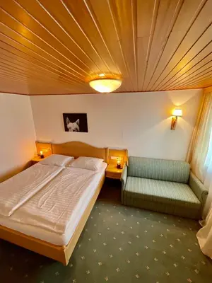 Ein Bett oder Betten in einem Zimmer der Unterkunft Die Bergretter Appartements