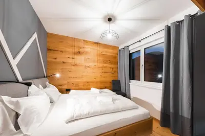 Ein Bett oder Betten in einem Zimmer der Unterkunft Aich Amadé by Alpenidyll Apartments