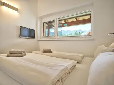 Ein Bett oder Betten in einem Zimmer der Unterkunft Alpinherz