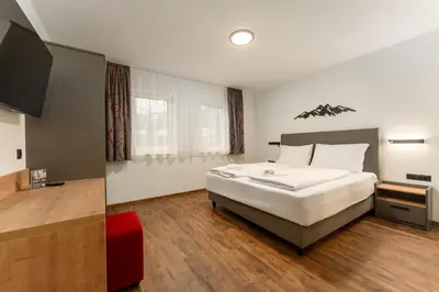 Ein Bett oder Betten in einem Zimmer der Unterkunft Das Ennshaus by Schladming-Appartements