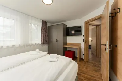 Ein Bett oder Betten in einem Zimmer der Unterkunft Das Ennshaus by Schladming-Appartements