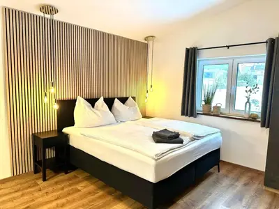 Ein Bett oder Betten in einem Zimmer der Unterkunft AlpLoft Apartment Top1