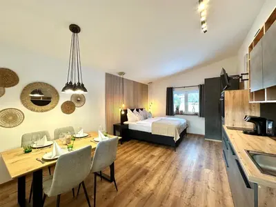Ein Bett oder Betten in einem Zimmer der Unterkunft AlpLoft Apartment Top1