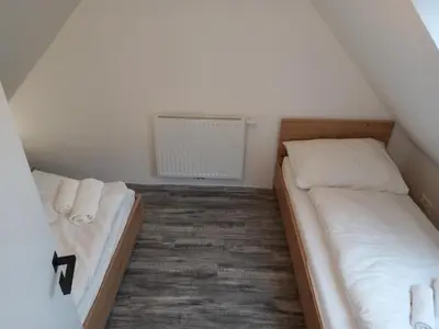 Ein Bett oder Betten in einem Zimmer der Unterkunft NRV Appartement Top 8