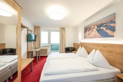 Ein Bett oder Betten in einem Zimmer der Unterkunft Hotel Appartement Winter