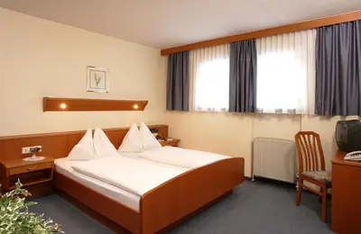 Ein Bett oder Betten in einem Zimmer der Unterkunft Hotel Appartement Winter