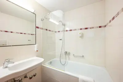 Ein Badezimmer in der Unterkunft Hotel Appartement Winter