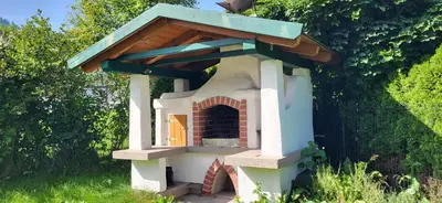 Ein Garten an der Unterkunft Ferienhaus Aich by Alpenidyll Apartments