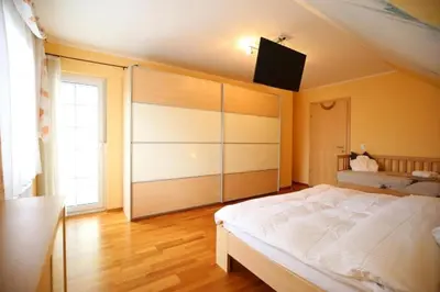 Ein Bett oder Betten in einem Zimmer der Unterkunft Ferienhaus Aich by Alpenidyll Apartments
