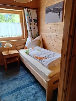 Ein Bett oder Betten in einem Zimmer der Unterkunft Chalet Siebenschläfer