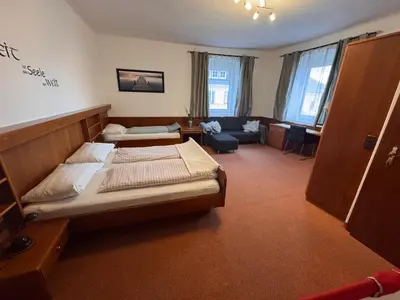 Ein Bett oder Betten in einem Zimmer der Unterkunft Austria Traveller Hotel Kirchdorf