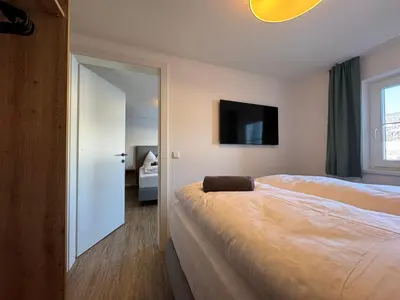 Ein Bett oder Betten in einem Zimmer der Unterkunft Appartement Radstadtblick