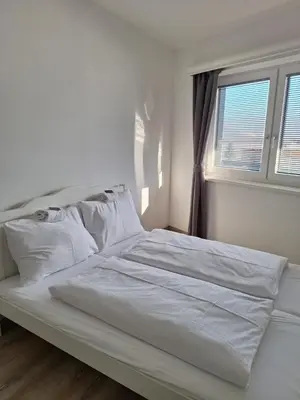 Ein Bett oder Betten in einem Zimmer der Unterkunft Ferienwohnung Mentenwirt Alp Lungau