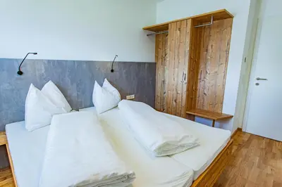 Ein Bett oder Betten in einem Zimmer der Unterkunft Happy Aich 4 by Alpenidyll Apartments - b70303