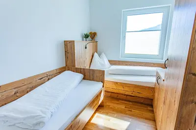 Ein Bett oder Betten in einem Zimmer der Unterkunft Happy Aich 4 by Alpenidyll Apartments - b70303
