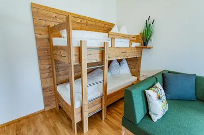 Ein Bett oder Betten in einem Zimmer der Unterkunft Happy Aich 4 by Alpenidyll Apartments - b70303