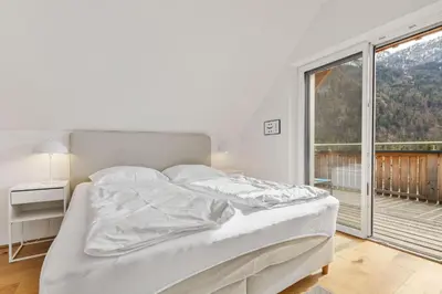 Ein Bett oder Betten in einem Zimmer der Unterkunft Panorama-Loft I Seenähe I Hallstatt