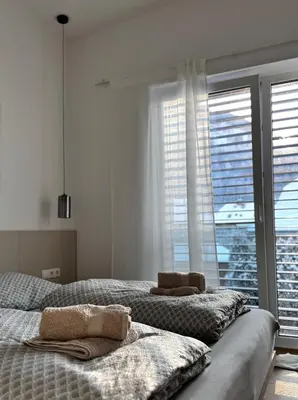 Ein Bett oder Betten in einem Zimmer der Unterkunft MiHome - modern Living