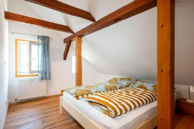 Ein Bett oder Betten in einem Zimmer der Unterkunft Apartments Sopherl - by myNests