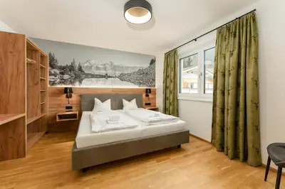 Ein Bett oder Betten in einem Zimmer der Unterkunft Das Sonnenhaus by Schladming-Appartements