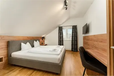 Ein Bett oder Betten in einem Zimmer der Unterkunft Das Sonnenhaus by Schladming-Appartements