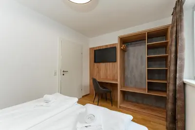 Ein Bett oder Betten in einem Zimmer der Unterkunft Das Sonnenhaus by Schladming-Appartements