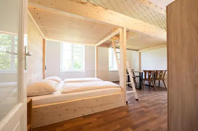 Ein Bett oder Betten in einem Zimmer der Unterkunft Nationalpark Gesäuse Lodge