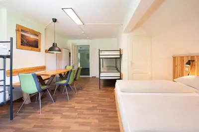 Ein Bett oder Betten in einem Zimmer der Unterkunft Nationalpark Gesäuse Lodge