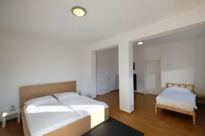 Ein Bett oder Betten in einem Zimmer der Unterkunft Alpenherz Appartment