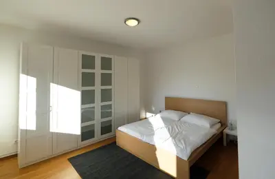 Ein Bett oder Betten in einem Zimmer der Unterkunft Alpenherz Appartment