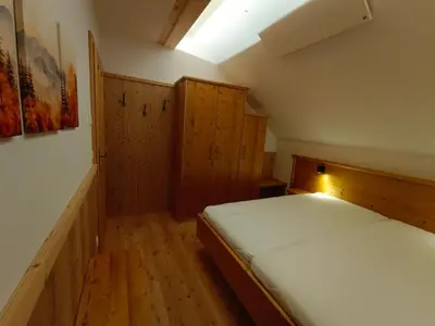 Ein Bett oder Betten in einem Zimmer der Unterkunft Brandnerhütte Tauplitzalm