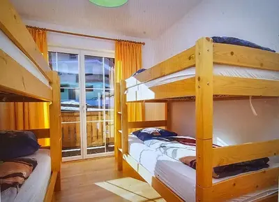 Ein Bett oder Betten in einem Zimmer der Unterkunft Chalet Hutberg Luxe Family ski home