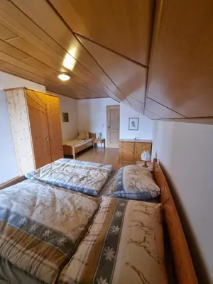 Ein Bett oder Betten in einem Zimmer der Unterkunft Ferienwohnung Schupfweber